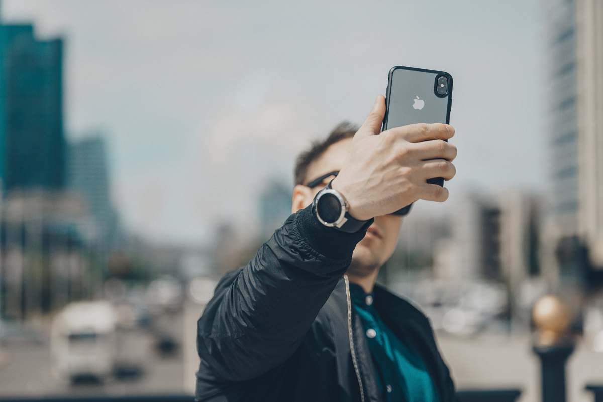 mobile phone person takes photo phone